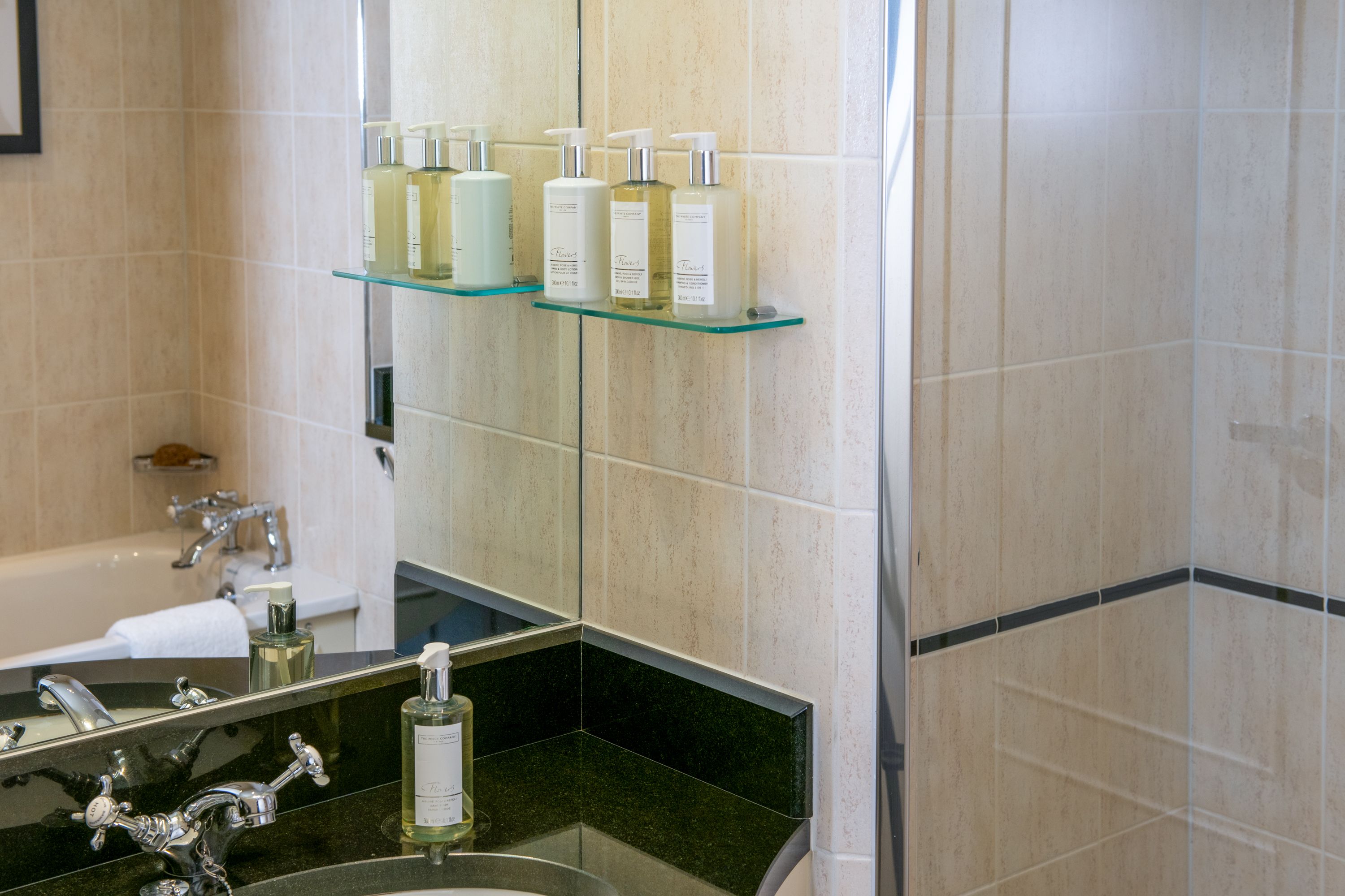 Bathroom with white company toiletries