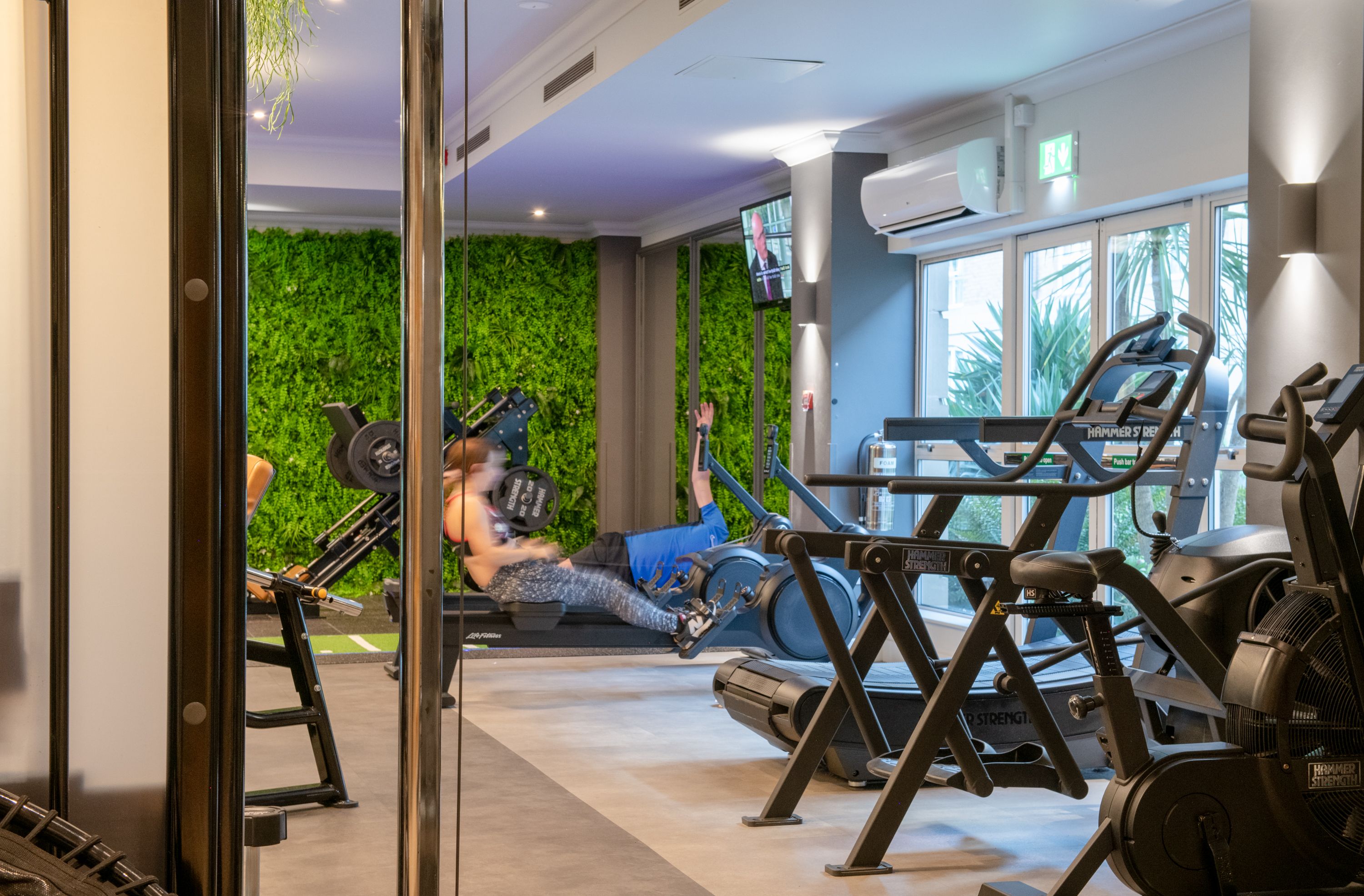 person working out on rowing machine