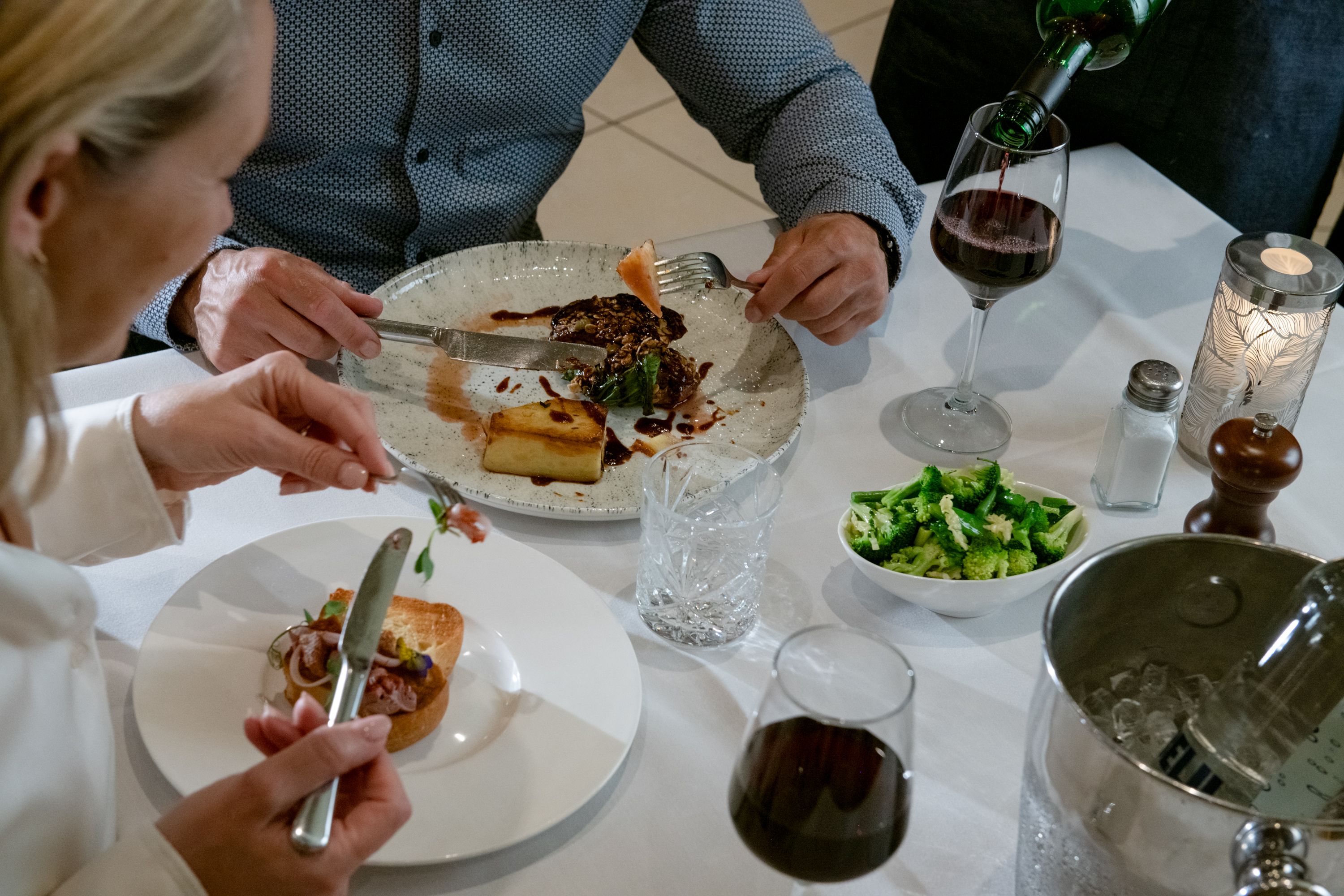 two plates of food on a restaurant table