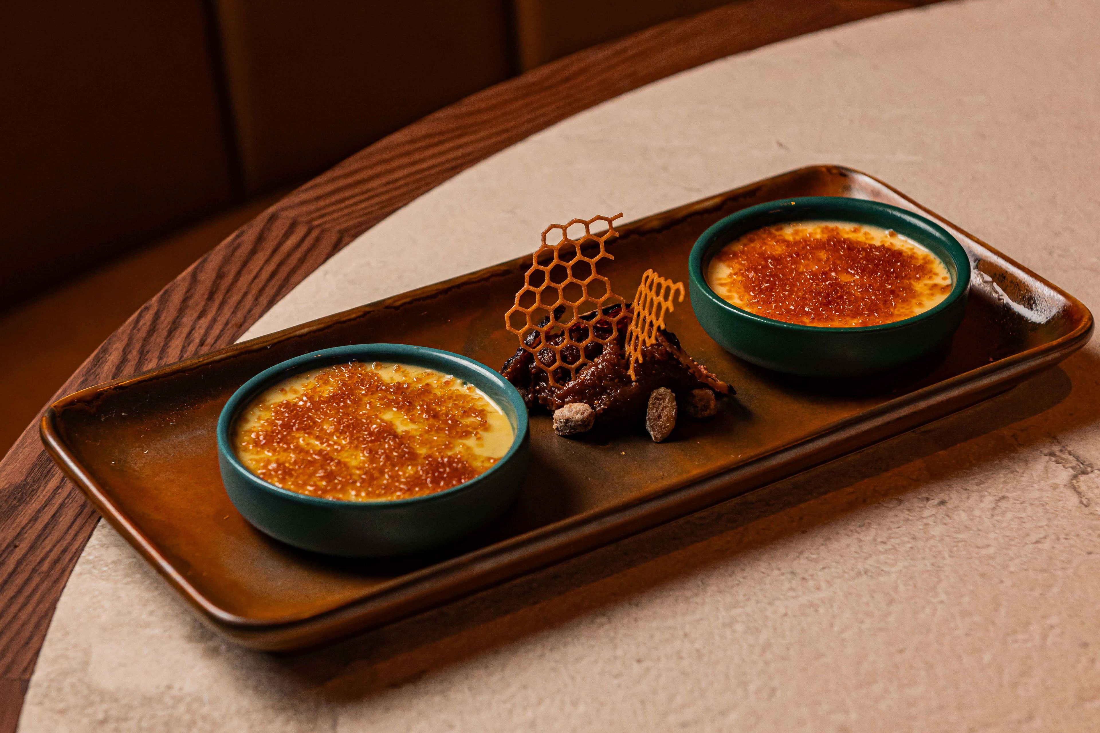 Flaming crème brûlée duo with pistachio, Annabel’s honey, fig compote